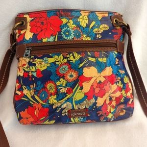 Great fall palette floral Sakroots crossbody purse with zip top closure.